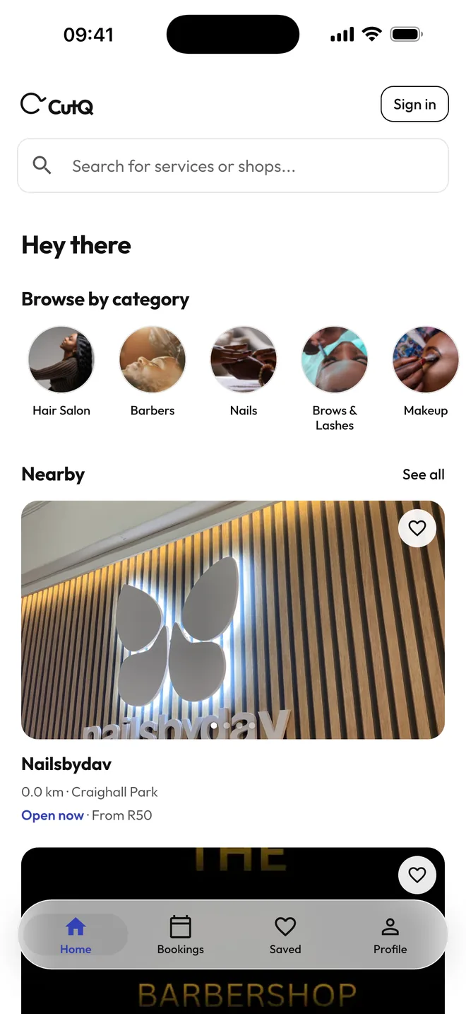 CutQ home screen on iPhone: search, browse by category, and nearby salons